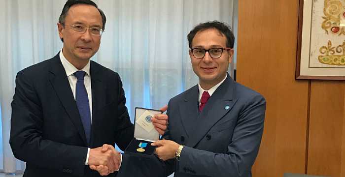 Secretary General Ambassador Ramil Hasanov was awarded with a medal by Kairat Abdrakhmanov Minister of Foreign Affairs of the Republic Kazakhstan.